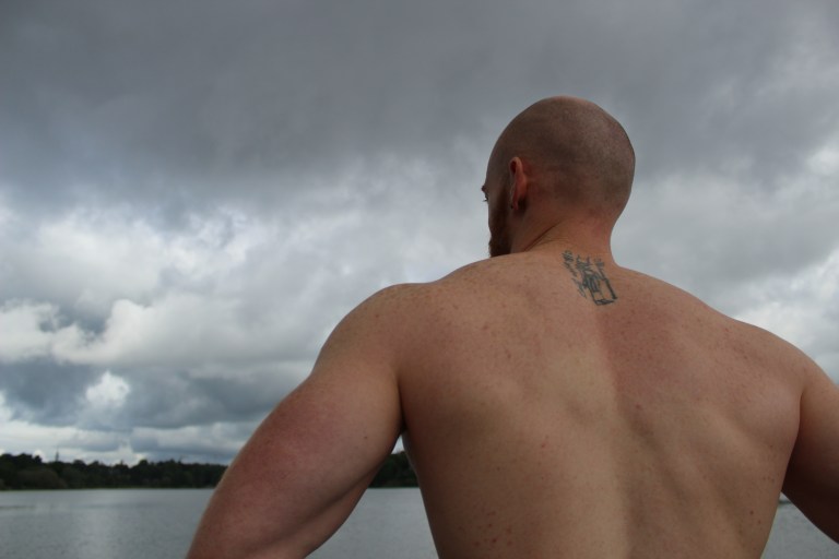 Leigh Ewin inspects the water under a threatening sky